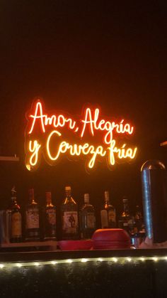 a neon sign that reads amaro, alegria y conegafia