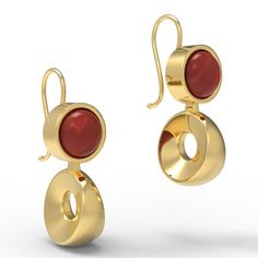 Our Flavia earrings are bold and stylish, with beautiful red garnet stone set into a round bezel, below which hangs a striking and solid wedge-shaped geometric ring. These earrings are based on an example found at Pompeii, from the first century AD. They feature the Roman hook at the back, but are also available with a post back. "Flavia" was the name of an important plebeian family, or gens, in ancient Rome. Over time, its members held such important posts as Tribune of the Plebs (fourth centur Modern Formal Earrings With Bezel Setting, Modern Bezel Set Earrings For Formal Occasions, Modern Yellow Gold Round Earrings, Modern Oval Cabochon Earrings, Modern Gold Earrings With Bezel Setting, Modern Cabochon Earrings For Formal Occasions, Modern Garnet Jewelry, Modern Yellow Gold Bezel Setting Earrings, Modern Ruby Jewelry For Formal Occasions