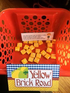 a yellow brick road game in a plastic basket