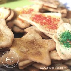 star shaped cookies with sprinkles on them are ready to be eaten for dessert