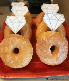 there are many donuts with diamond decorations on top of them, and one is white