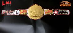 a gold and red wrestling belt on display