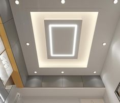 an overhead view of a bathroom with lights on the ceiling and mirrors in the wall