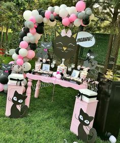 a cat themed birthday party with balloons and decorations