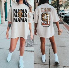 "This cute Personalized Football Mom Shirt is perfect to wear for your child as a Custom Game Day Mama Football Tee, comes with the cutest leopard print football design letters and numbers! These personalized mom jersey shirts make wonderful gifts to show such proud support including her customized kid's football Name & Number on the back of your football Game Season Shirt! Any Game day Sports Mom would love this football game day Tee! * This is a normal Unisex size Bella Canvas 3001 T-Shirt * F Baseball Team Gift, Sports Mom Gifts, Basketball Mom Shirts, Baseball Mom Shirt, Number Shirt, Baseball Mama, Bride Shirt