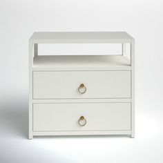 a white nightstand with two drawers on each side