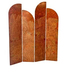 four wooden boards with designs on them, all in different shapes and sizes are standing side by side against a white background