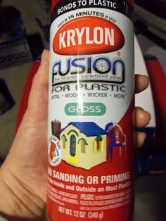 a person holding a red spray can in their hand with the words krylon on it