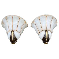 a pair of scallop style wall lights