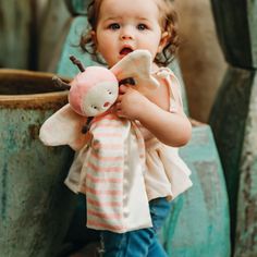 11 inch version of our Buddy Blanket Baby Safe Embroidered details easy to snuggle, with satin lining 100% polyester machine wash, dry low heat A delightful Garden Friend indeed, Butterfly Bye Bye Buddy Blanket! With a pink velour body, adorned with an expertly embroidered face, is both endearing and thoughtfully crafted with your little one’s safety in mind. Dainty knotted gray velour serves as her antennas and arm adding a charming touch to her whimsical design, and gentle polka-dotted wings n Baby Name Reveal, Baby Security Blanket, Handmade Baby Gifts, Best Baby Gifts, Embroidered Face, Soft Baby Blankets, Lovey Blanket, Encouragement Gifts, Whimsical Design