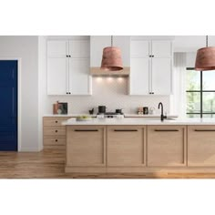 a kitchen with white cabinets and blue doors