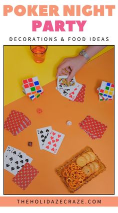 an orange table topped with cards and chips