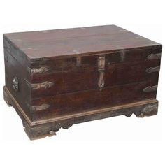 an old wooden chest with metal handles