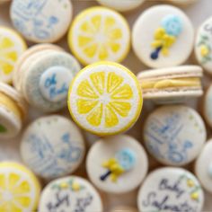 a close up view of some yellow and white candies with lemon slices on them