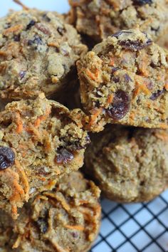 a pile of cookies sitting on top of a cooling rack