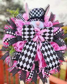 a black and white bunny wreath with pink bows