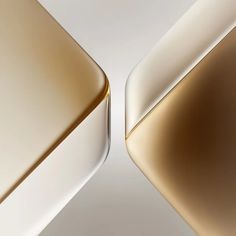 the back side of an apple macbook pro with gold and silver accents on it