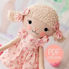 a stuffed animal doll wearing a pink dress