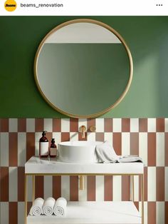 a bathroom with green walls and checkered tile on the floor, round mirror above sink