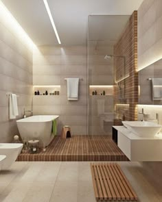 a large bathroom with two sinks and a bathtub next to a walk in shower