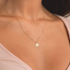 Embrace the warmth of sunshine with our enchanting Mini Sunflower Necklace, meticulously crafted in your choice of gold filled, sterling silver, or rose gold filled. This delicate piece captures the essence of a blooming sunflower, bringing nature's beauty closer to your heart. 🌻 Symbol of Joy: The mini sunflower pendant symbolizes joy, positivity, and the beauty of life. Wear it as a daily reminder to radiate positivity and embrace the simple pleasures. * We use the Highest Quality materials f Sunflower Necklace Silver, Blooming Sunflower, Mini Sunflowers, Initial Disc Necklace, Engraved Bar Necklace, Radiate Positivity, Sunflower Pendant, Bar Necklace Personalized, Silver Bar Necklace