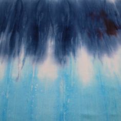 an abstract painting with blue and white colors on it's surface, including trees in the background