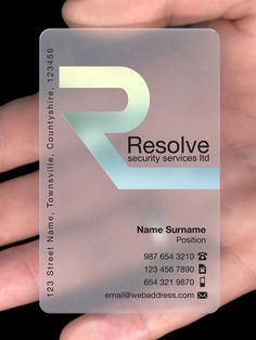 a hand holding a business card that says resolve security services ltd