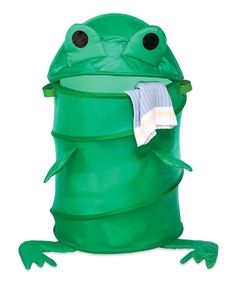 a green frog sitting on top of a trash can with a towel hanging from it's back