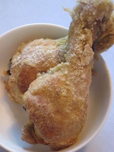 two pieces of fried food in a white bowl