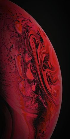 an abstract red and black background with swirls on the bottom half of the image