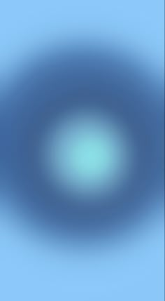 a blurry image of a blue circle in the sky