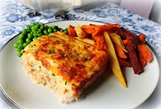 a white plate topped with meat and veggies