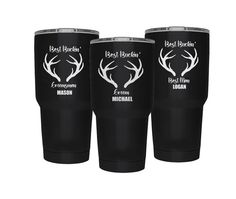 three black tumblers with white deer antlers and the words best western on them