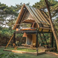 a small house made out of wood and metal with a roof that is pitched into the grass