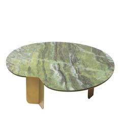 a green marble coffee table with gold legs and an oval shaped base, on a white background