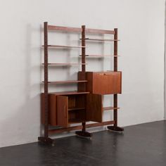 a wooden shelf with drawers and shelves on it