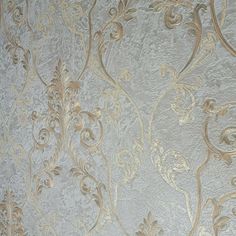 an ornate wallpaper with gold and silver designs on white background, closeup view