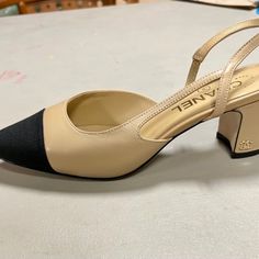 Beige Sling Back With Black Cap Toe. Softest Goat Skin Leather. Authentic Serial Number. See Pic. Feels Like Butter. A Beautiful Shoe For The Holidays. Brand New Never Worn. Come With Beautiful Dust Bag. Don’t Want To Miss These. Channel Sling Back Shoes, Chanel Slingback Shoes Two Tones, Chanel Classic Heels, Cap Toe Shoes, Red Converse, Princess Coloring, Coach Wristlet, Black Cap, Chanel Black