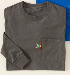 Unisex long sleeve gray tshirt embroidered with mini skier "straight lining" down side of pocket.   (blue version is "ski jumper" - separate listing).  Unisex sizing so for more fitted option, size down for females.  Perfect for the ski season lover.  Can customize skier colors.  All products machine washable. Embroidered T Shirt Ideas, Embroidered Hats Ideas, Embroidery For Men, Ski Shirt, Embroidered T Shirt, Ski Jumper, Ski Shirts, Ski Gifts, Tea Shirt