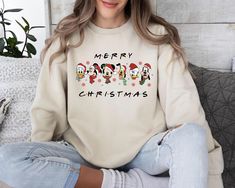 Mickey And Friends Christmas Sweatshirt, Christmas Sweater, Christmas Mickey Sweater, Christmas Party, Holiday Season, Christmas Gift Welcome to our store where you can find beautiful sweaters specially prepared for you. Make yourself and your loved ones happy with these special sweaters. Product details: *Collar, shoulders, armholes, cuffs and bottom hem are double stitched. *1 x 1 rib contains spandex for flexibility. *Collar type: Crewneck *Relaxed fit - Unisex *50% cotton 50% polyester blend Mickey And Friends Christmas, Christmas Mickey, Mickey Mouse Christmas, Friends Christmas, Disney Sweaters, Looking Forward To Seeing You, Friend Christmas, Beautiful Sweater, Sweatshirt Christmas