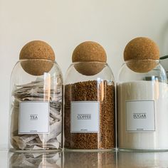 Ournew range of Tea Coffee Sugar Canistersare a perfect addition to your kitchen counterpantry or kitchen cupboardWith its unique and stylish design featuring the cork ball lidsthey add class and style to your kitchen worktopIf you are either a coffee lovertea lover or hot chocolate lover this will add an element of class to your Hot Drink StationYou can create a uniques beautiful corner on your kitchen worktop with theteacoffeesugar jarswith matching labelsThe labels are finished with top qual Kitchen Cannister Ideas, Tea Corner Kitchen, Glass Jars Kitchen Counter, Sugar Tea Coffee Containers, Tea Station Kitchen, Tea Corner Ideas, Tea And Coffee Jars, Tea Corner, Coffee Minimalist