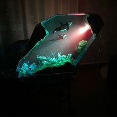 an illuminated umbrella sitting on top of a table