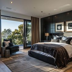 a large bed sitting in the middle of a bedroom next to a window covered with curtains