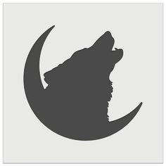 the silhouette of a wolf on top of a moon