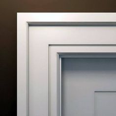 an open white door on a brown wall