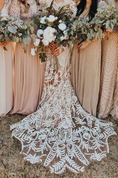 the bride and her bridesmaids are holding their bouquets