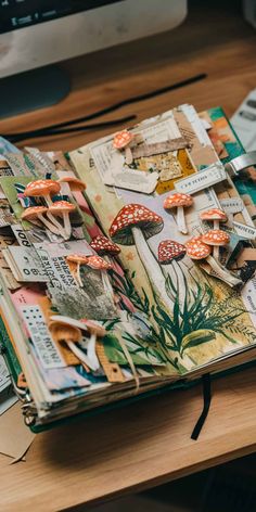 an open book sitting on top of a wooden desk