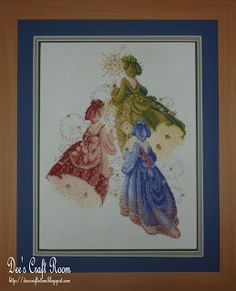 two women in dresses cross stitched together on a white background with green and red accents