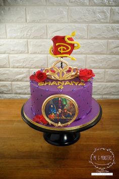 the cake is decorated with beauty and the beast characters on it's top tier