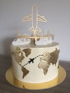 a birthday cake with an airplane and map on it